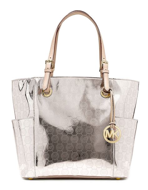 michael kors jet set large metallic leather tote|Michael Kors bag with airplanes.